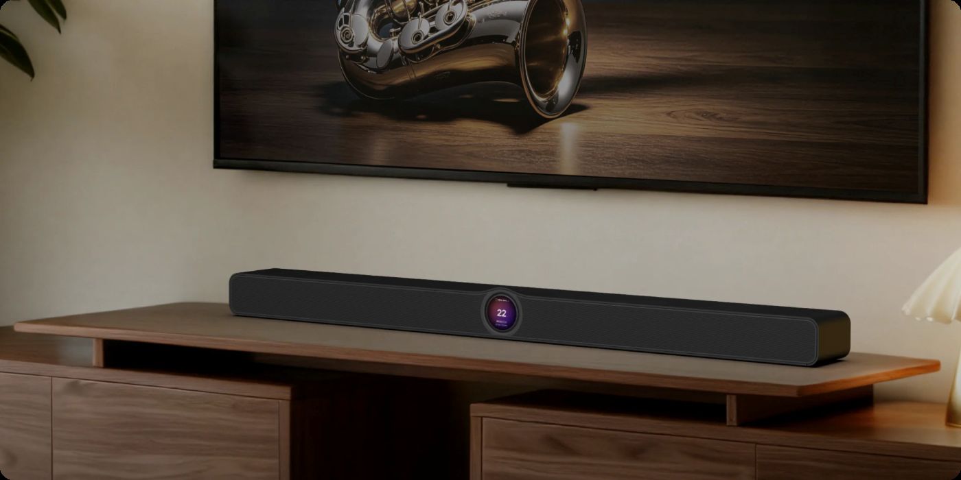 WiiM Bar plassert på en TV-benk med en TV synlig over.